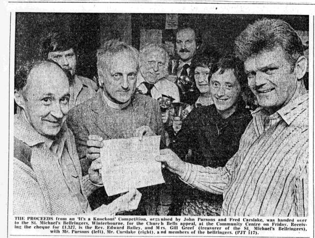 Fred hands over the cheque